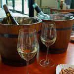 Wine Glasses in fron of Barrerl Coolers
