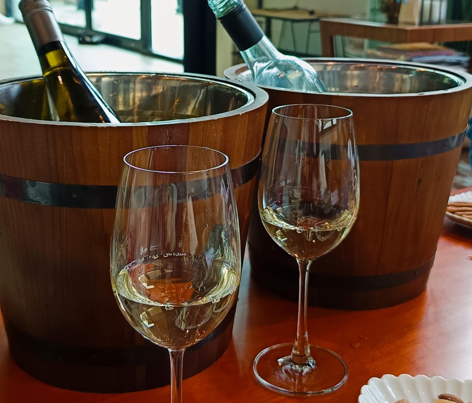 Wine Glasses in fron of Barrerl Coolers